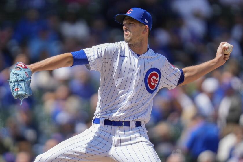 Chicago Cubs starting pitcher Drew Smyly throws during the first inning of a baseball game.
