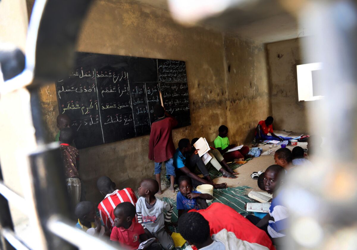 Children known as talibes learn at a daara, or religious school, in the Keur Massar suburb of Dakar.