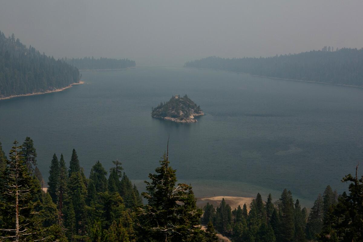 Smoke from the Caldor fire shrouds Fannette Island and obstructs the view of Lake Tahoe.