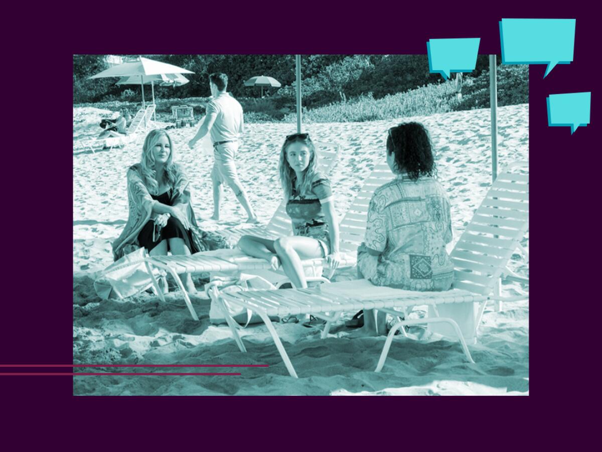 Three women talk while sitting on beach lounge chairs.