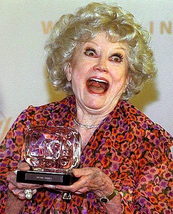 Diller holds a Lucy Award in 2000. The award, named for Lucille Ball, honored Diller's achievements in television.