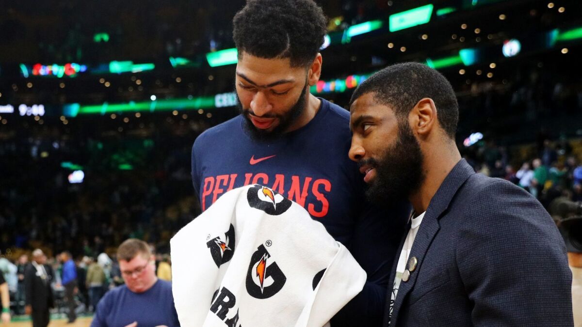 Anthony Davis and Kyrie Irving chat after a game in Boston in December. They could be teammates next season.