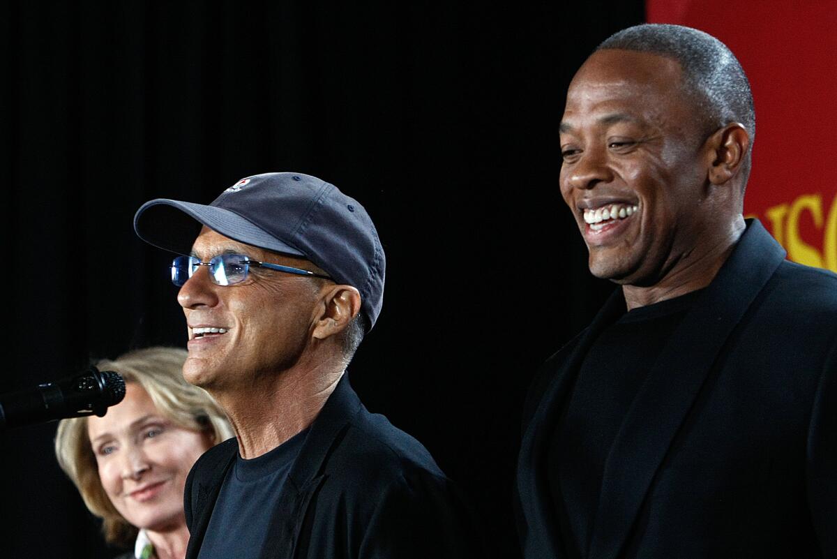 Beats was cofounded by music mogul Jimmy Iovine, left, and rapper Dr. Dre.