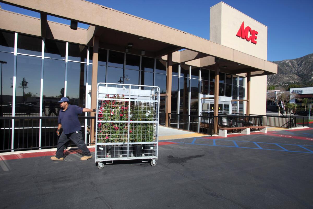 Employees prepare for the grand opening of Ace Hardware in La Crescenta on Feb. 14. The store had a soft opening last month.
