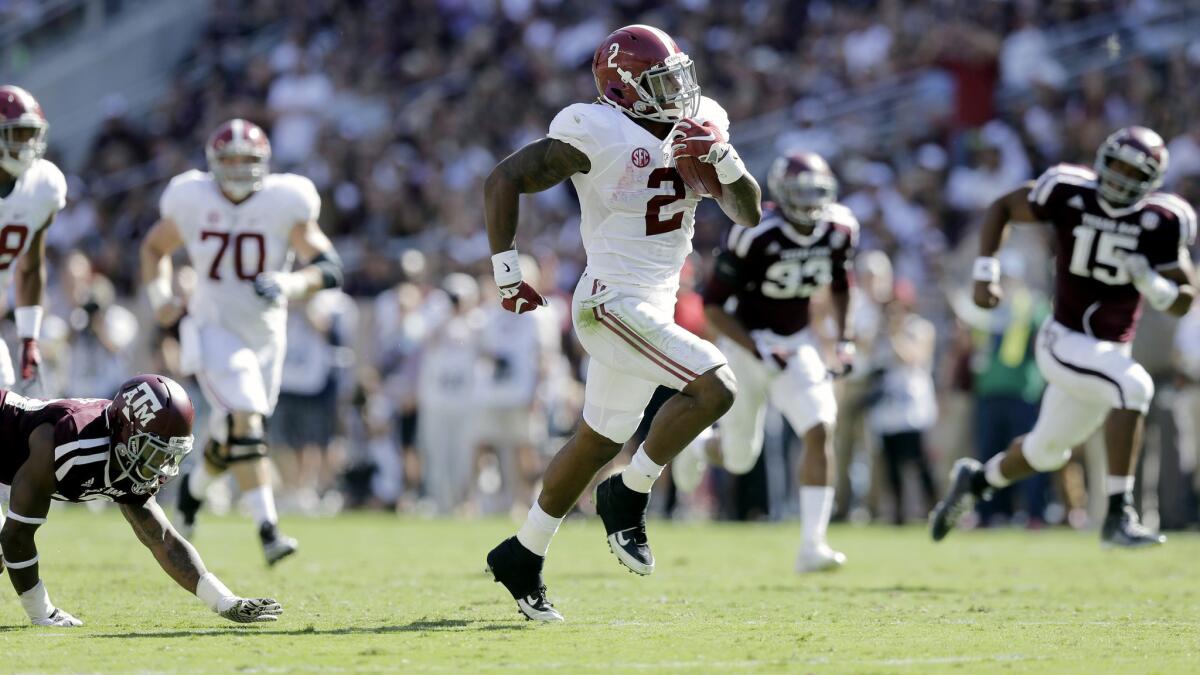 Alabama running back Derrick Henry (2) breaks into the clear on a 59-yard touchdown against Texas A&M in the first half Saturday.