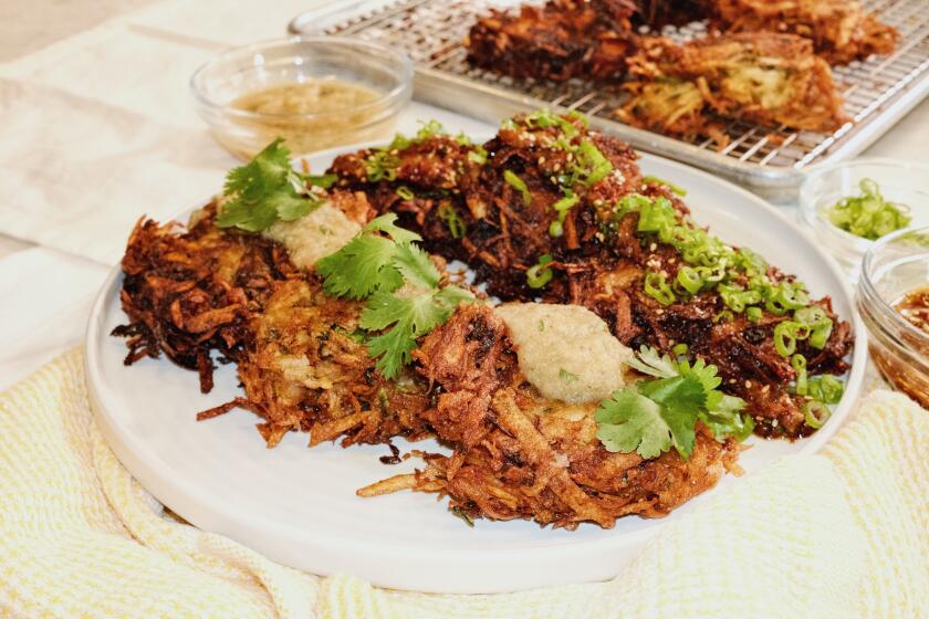 EL SEGUNDO, CALIF. -- NOV. 3, 2025 -- Oy Bar chef-owner Jeff Strauss prepares two varieties of latkes in The L.A. Times Test Kitchen. (Stephanie Breijo / Los Angeles Times)