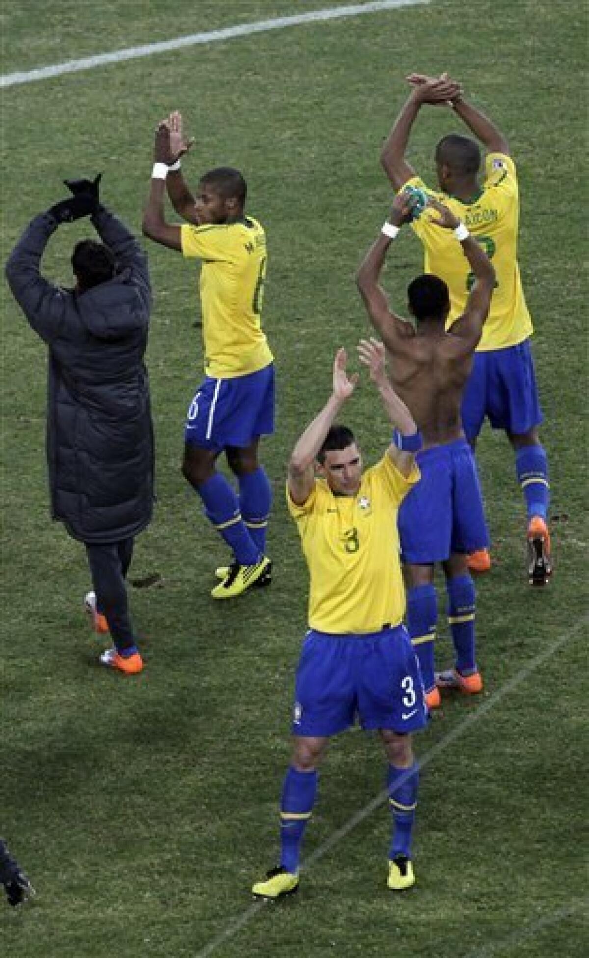 Brazil's players applaud as they leave the pitch after the World Cup group G soccer match between Brazil and Ivory Coast at Soccer City in Johannesburg, South Africa, Sunday, June 20, 2010. (AP Photo/Marcio Jose Sanchez)