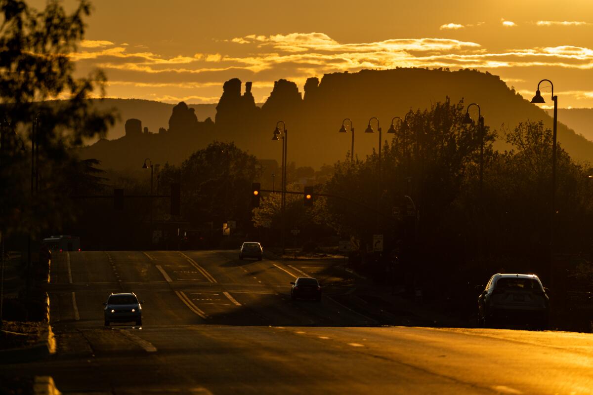The sun sets over Arizona State Route 89A.