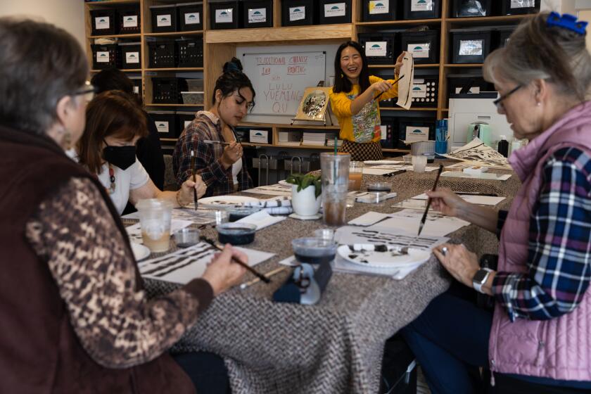 Lulu Yueming Qu teaches a traditional Chinese ink painting workshop at ArtReach’s headquarters in San Diego on Saturday, Oct. 15, 2022. The nonprofit’s “Community. Access. Connection.” workshop series are led by professional artists from San Diego and will have pet portrait painting, art journaling and linoleum block printing for their following classes. Proceeds go to programs at Title I schools.