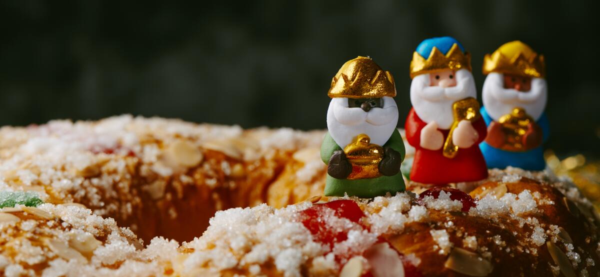 The three wise men, Melchior, Caspar and Balthazar, on top of a Three Kings cake.