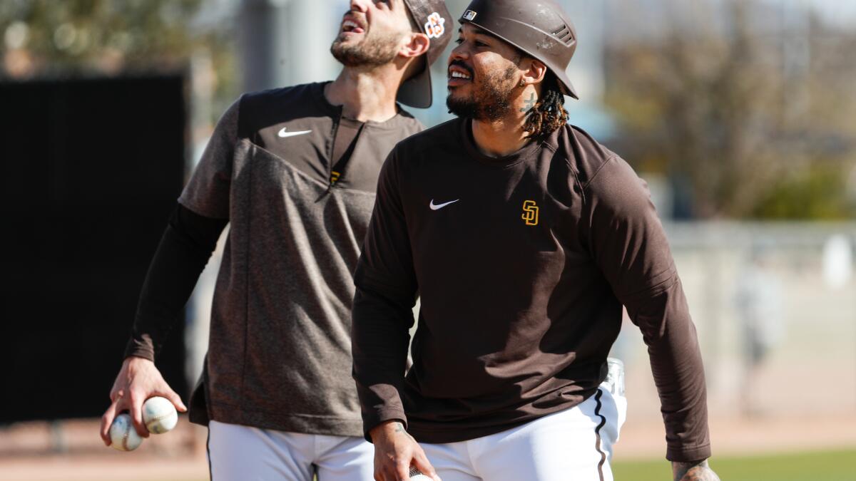 San Diego Padres catcher Austin Nola greets pitcher Nick Martinez