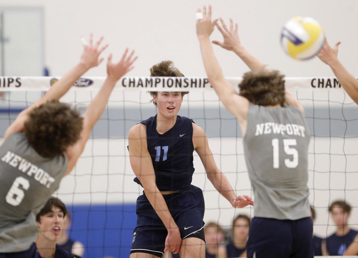 Corona del Mar's Sterling Foley (11), seen against Newport Harbor on May 13, had 18 kills against Upland on Tuesday.