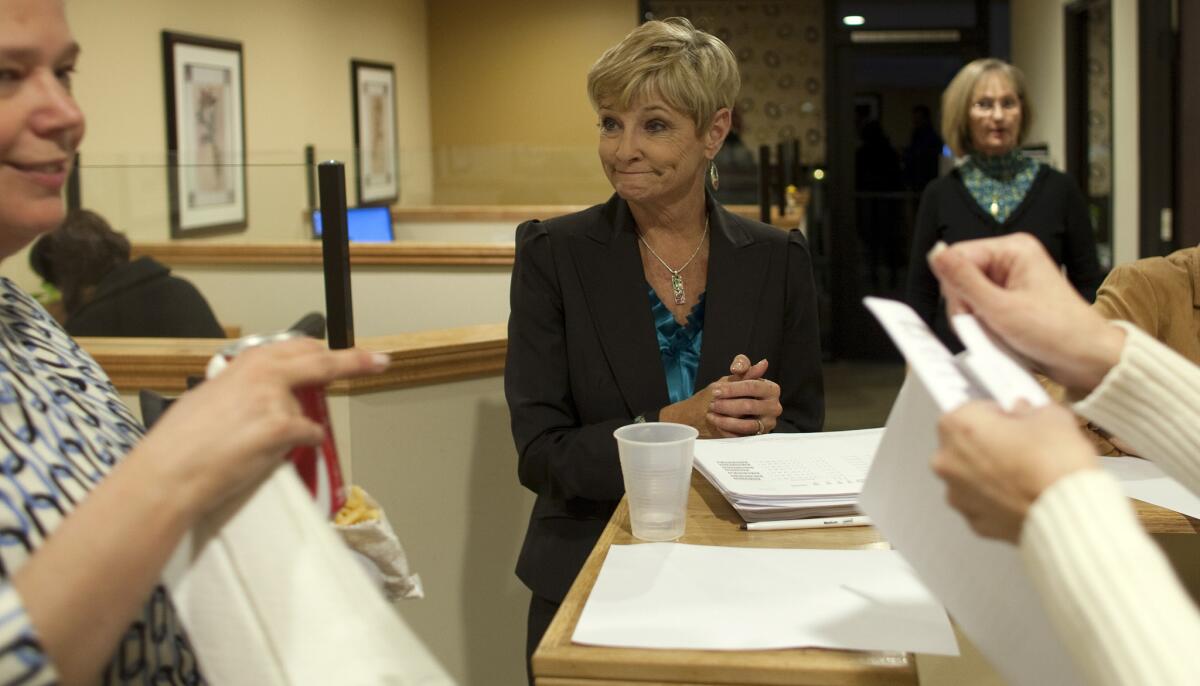 Republican candidate for state Senate Sharon Runner, center, chats with supporters in 2011.