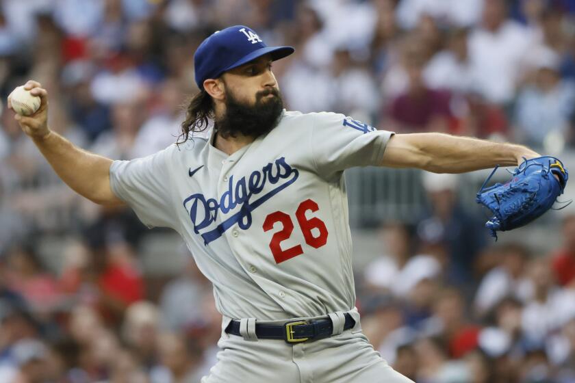 Los Angeles Dodgers starting pitcher Tony Gonsolin throws to an Atlanta Braves batter.