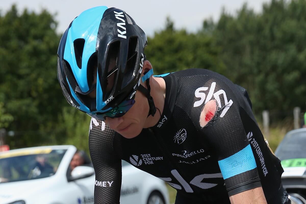 Chris Froome chases back to the peloton after being involved in a crash.