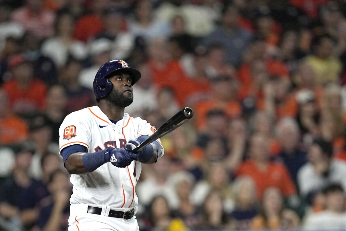 Houston Astros' Yordan Alvarez watches his two-run home run against the Los Angeles Angels during the first inning of a baseball game Monday, April 18, 2022, in Houston. (AP Photo/David J. Phillip)