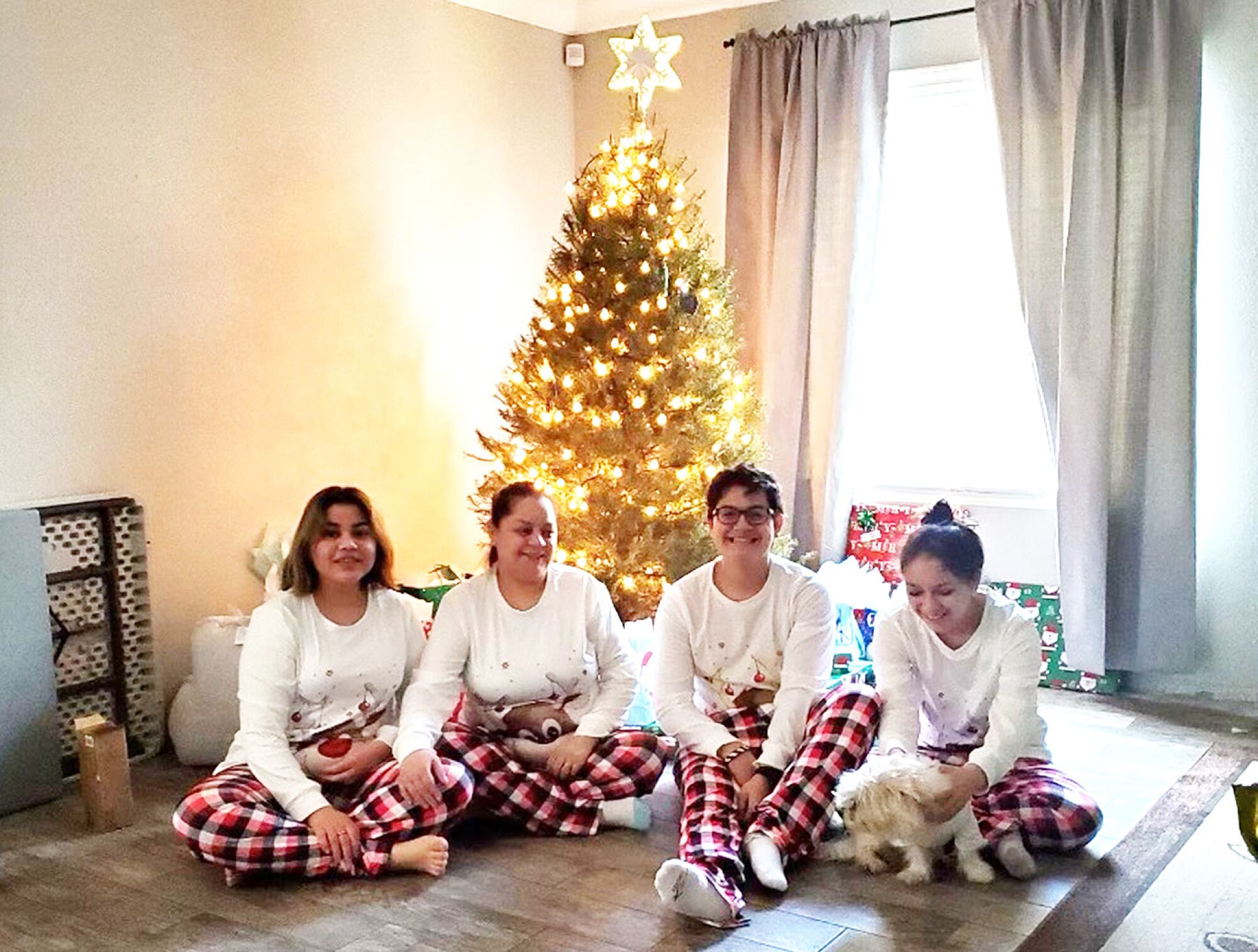 Anthony Reyes Jr., second from right, with his sisters, Marissa, left, Reyna, right, and mother, Stephanie Reyes