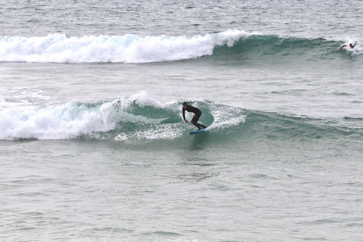 Ella Catalano-Dockins surfing in the waters off Half Moon Bay