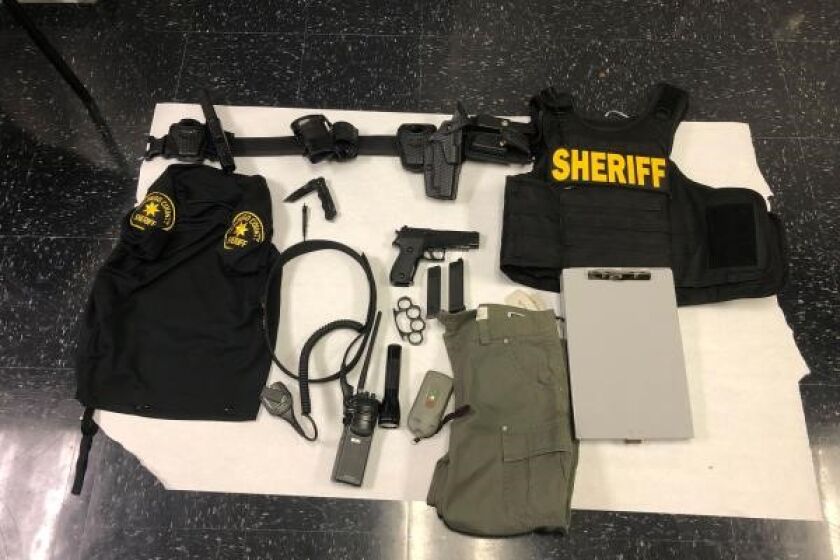 Michael Carmichael, 21, was impersonating a deputy and carrying these items when he pulled over a driver Monday in Fallbrook. 