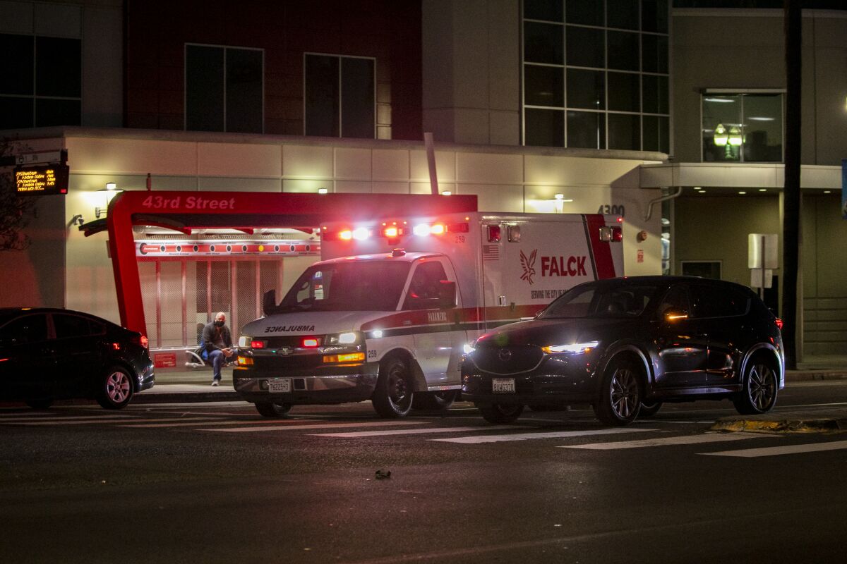 A Falck ambulance speeds along El Cajon Boulevard on Wednesday, Jan. 5, 2022.