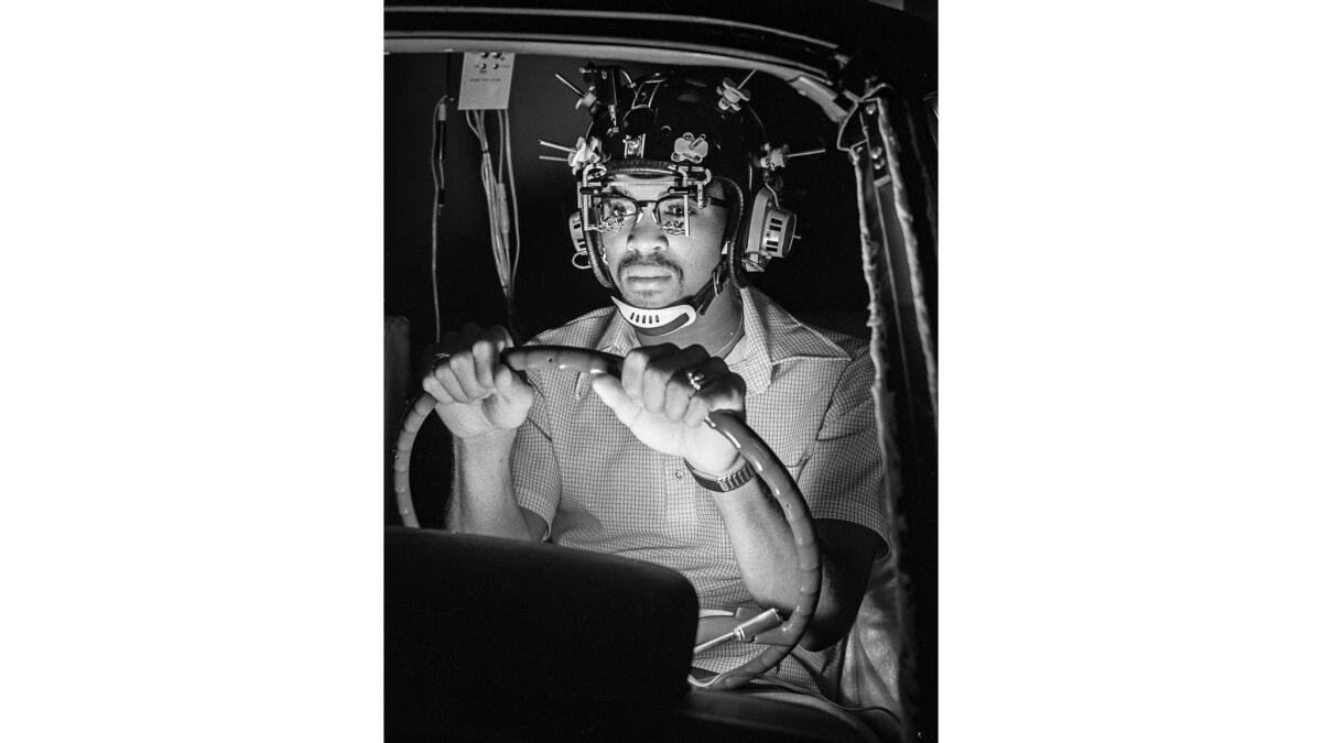 March 1977: Research assistant in automobile simulator used to test reactions to drug and alcohol at the Southern California Research Institute.