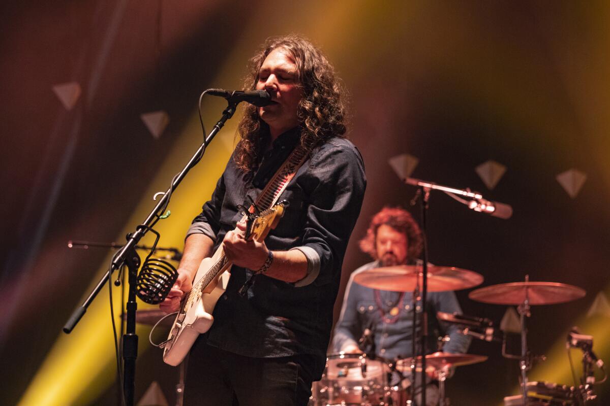 Adam Granduciel of The War On Drugs performs on stage.