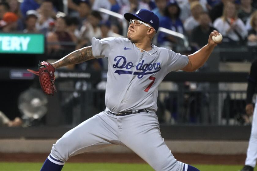 Los Angeles Dodgers pitcher Julio Urias delivers against the New York Mets during the fourth inning.