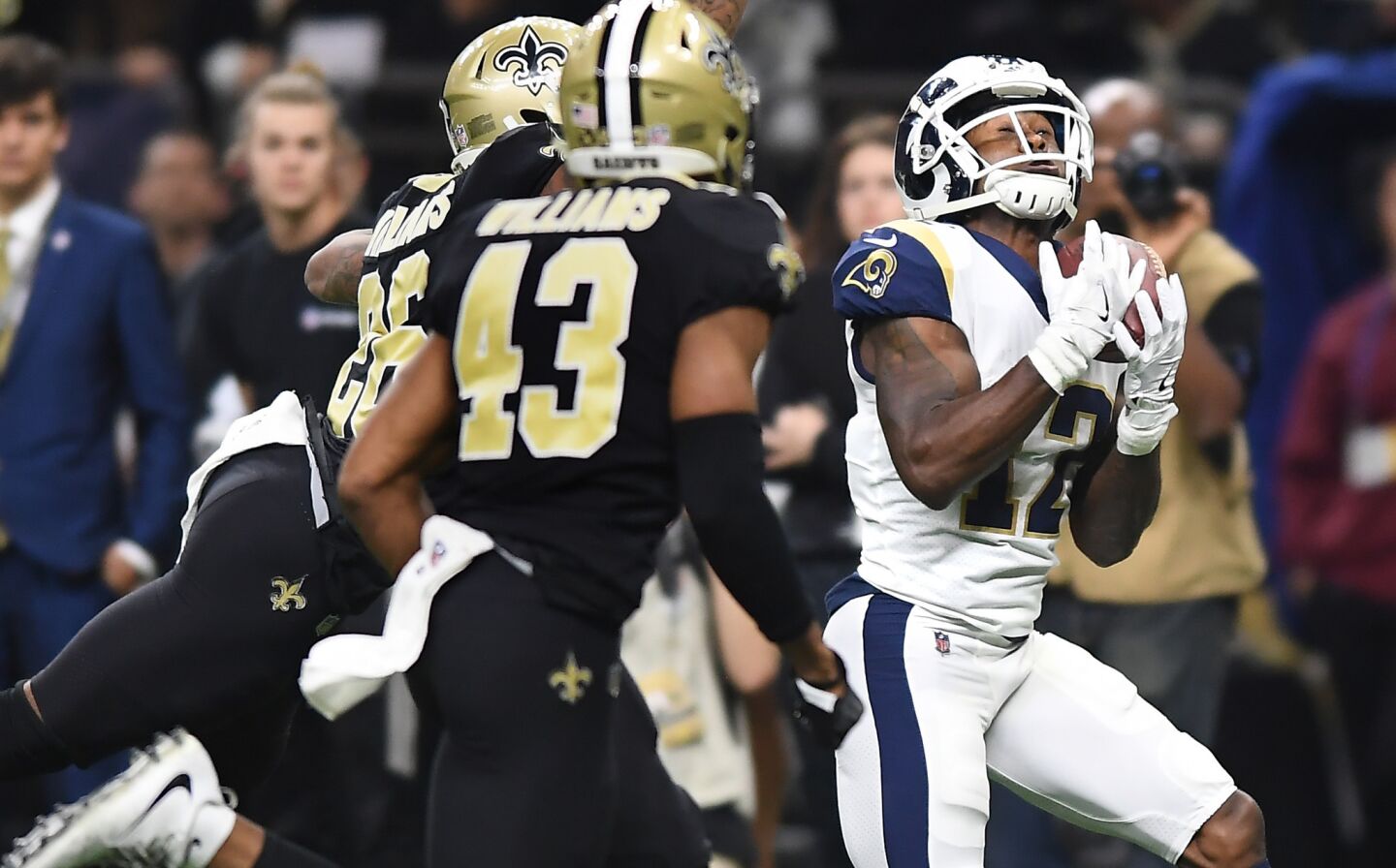 Rams receiver Brandin Cooks makes a catch against the Saints defense to set up a touchdown late in the second quarter in the NFC Championship at the Superdome on Jan. 20.