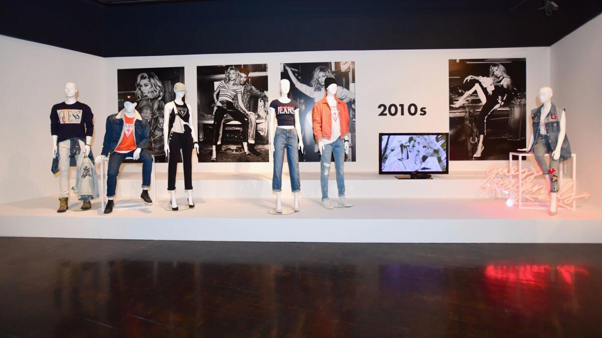 One part of the Guess exhibit showcases looks from each decade. (Emma McIntyre / Getty Images for Guess Inc.)
