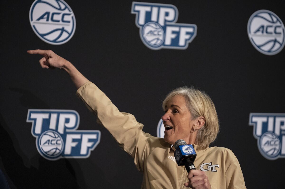 Georgia Tech head coach Nell Fortner smiles while gesturing during NCAA college basketball Atlantic Coast Conference media day, Wednesday, Oct. 13, 2021, in Charlotte, N.C. (AP Photo/Matt Kelley)