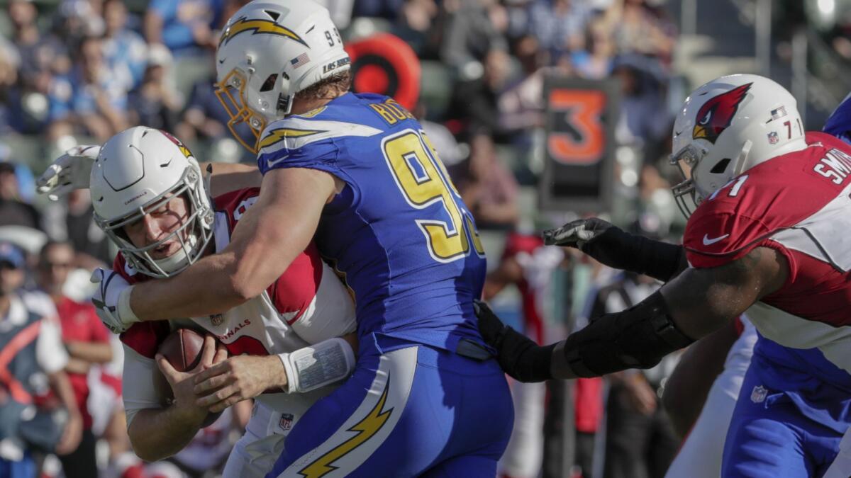 Chargers defensive end Joey Bosa sacks Arizona Cardinals quarterback Josh Rosen in the second quarter at StubHub Center on Sunday.