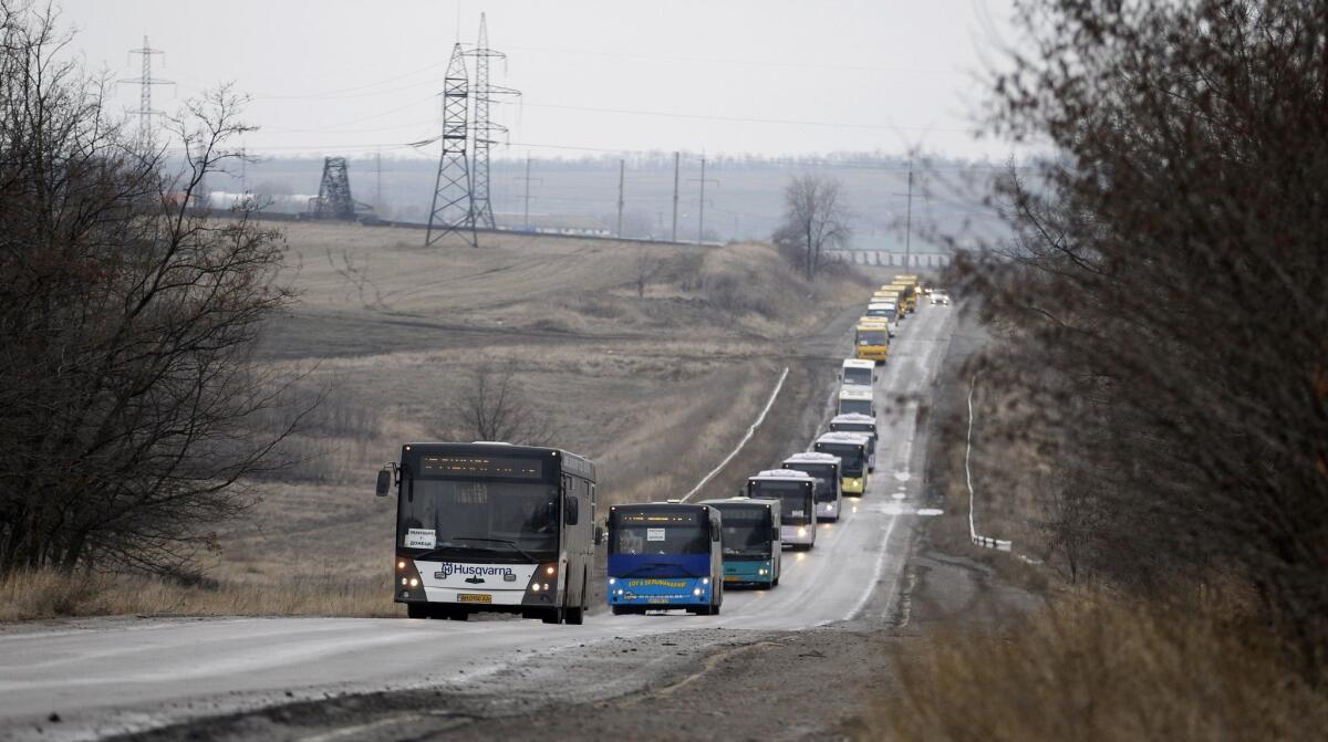 Buses heads into Debaltseve, in eastern Ukraine, on Friday to evacuate civilians trapped by fighting between soldiers and Russia-backed separatists.