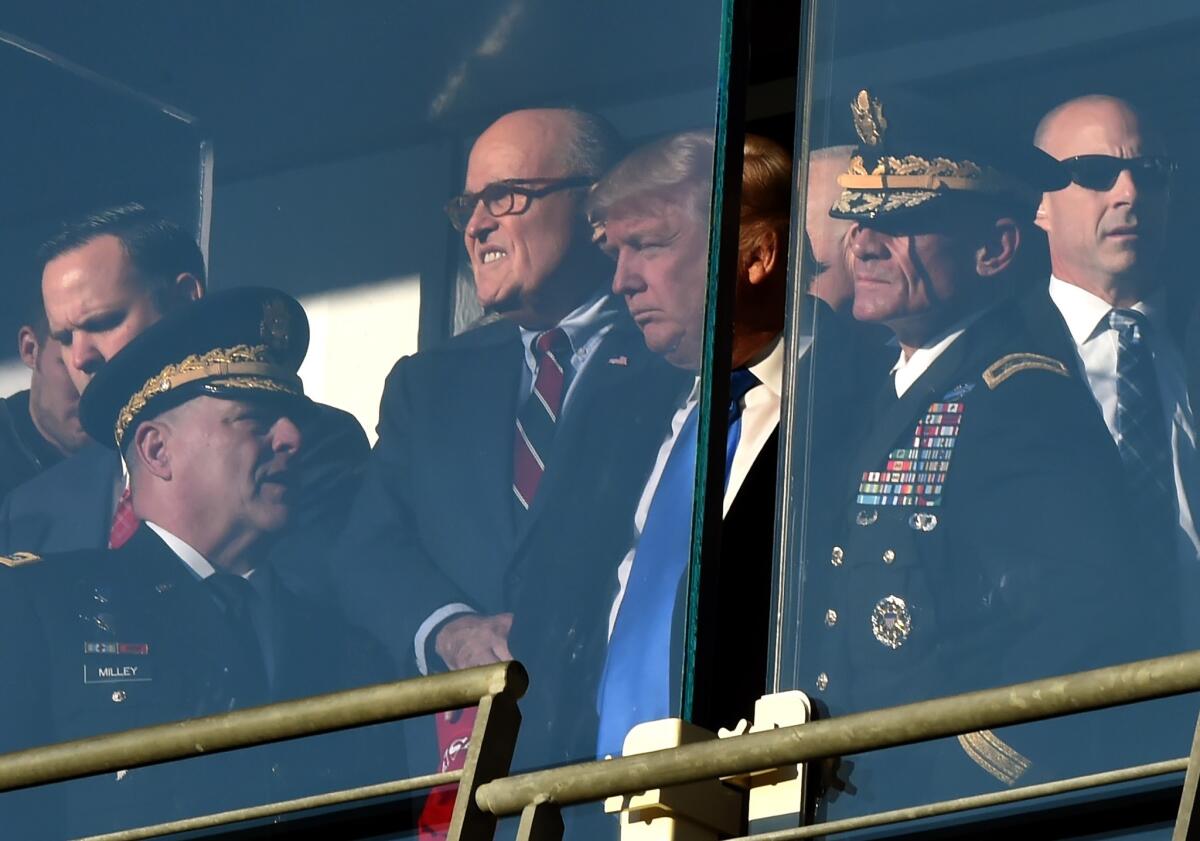 President-elect Donald Trump attends the 117th Army-Navy football game with former New York City Mayor Rudy Giuliani in Baltimore on Dec. 10, 2016.