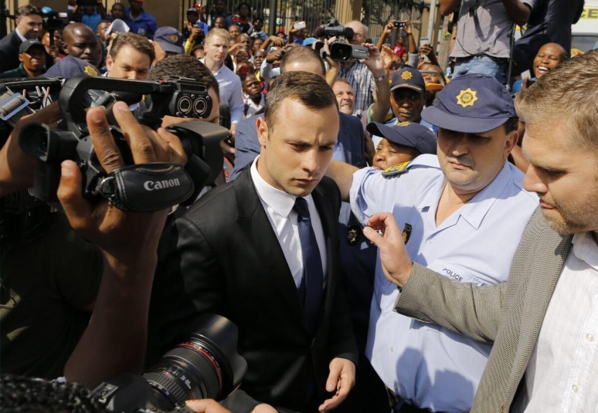 Oscar Pistorius leaves court.