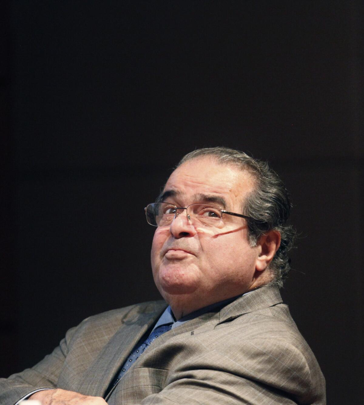 Supreme Court justice Antonin Scalia is seen before addressing the Chicago-Kent College Law justice in Chicago in 2011. On Monday, Scalia defended his legal writings that some find offensive and anti-gay.