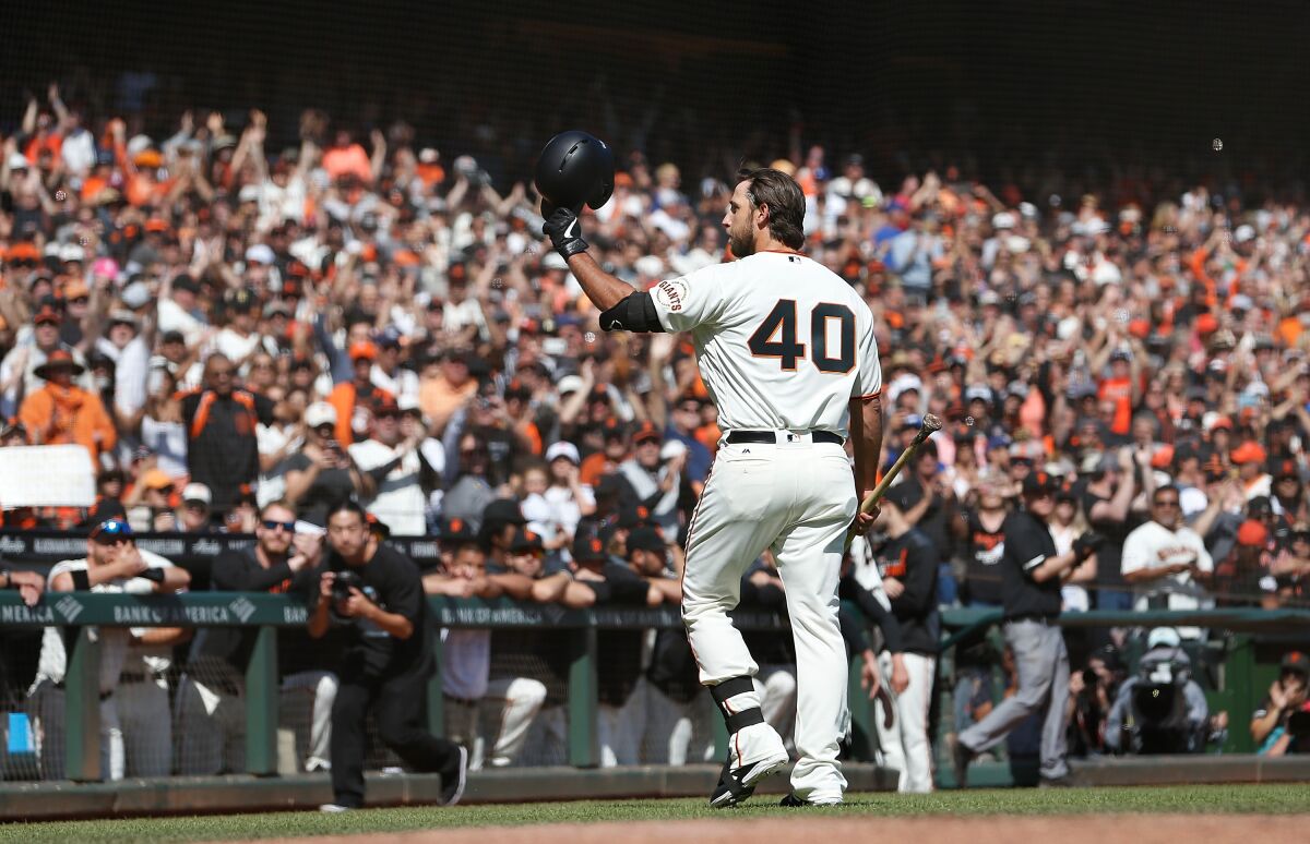 Giants pitcher Madison Bumgarner acknowledges the fans after pinch hitting against the Dodgers on Sunday.