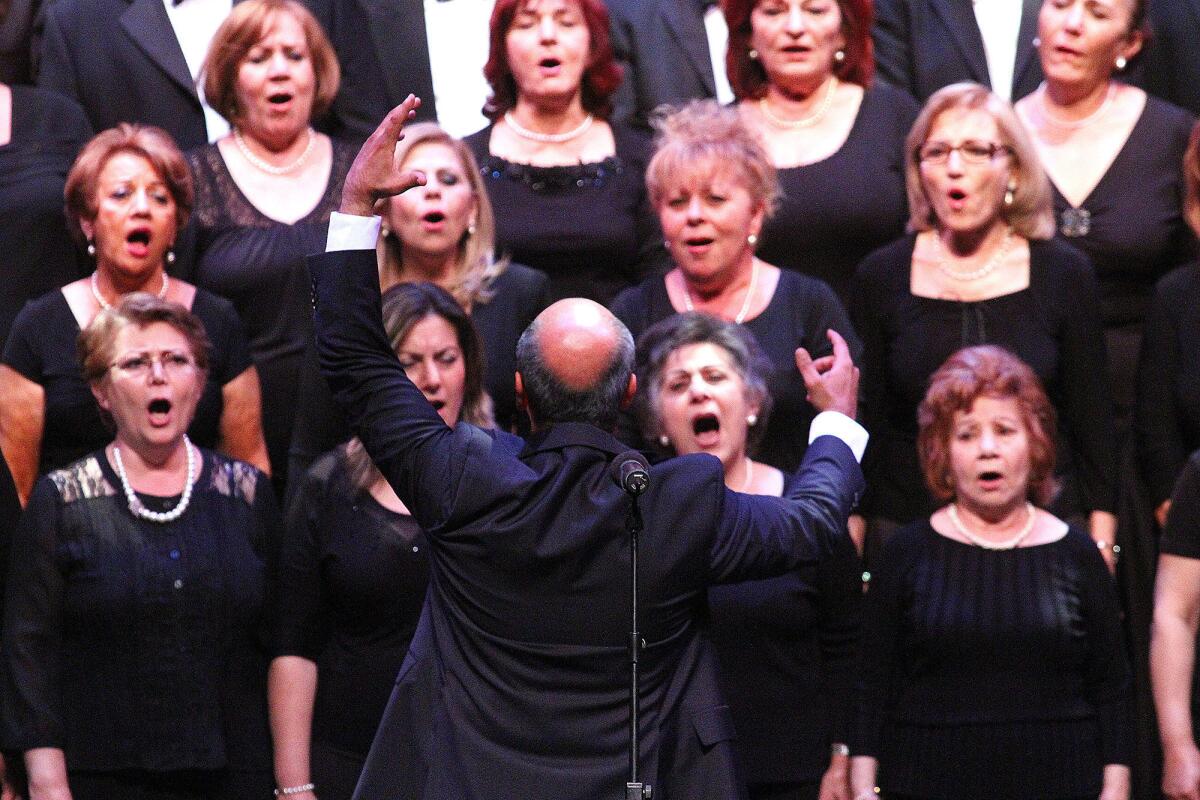 Director Michael Avedissian brings out the power of the voices of the Armenian Society of Los Angeles Choir at the City of Glendale's 13th Annual Commemoration of the Armenian Genocide at the Alex Theatre in Glendale on Thursday, April 24, 2014.