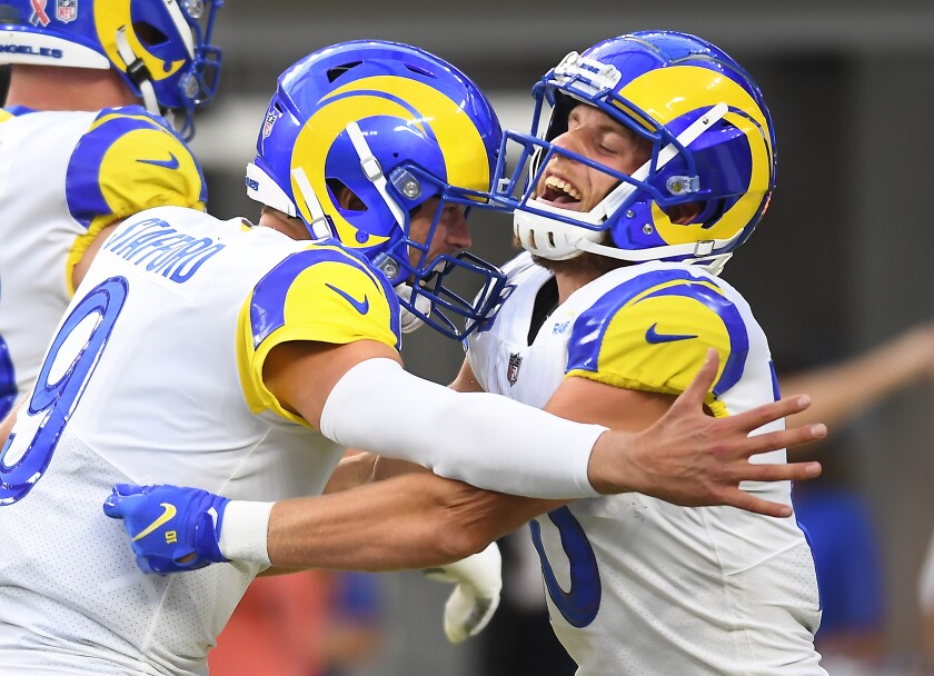 Rams quarterback Matthew Stafford celebrates with Cooper Kupp.