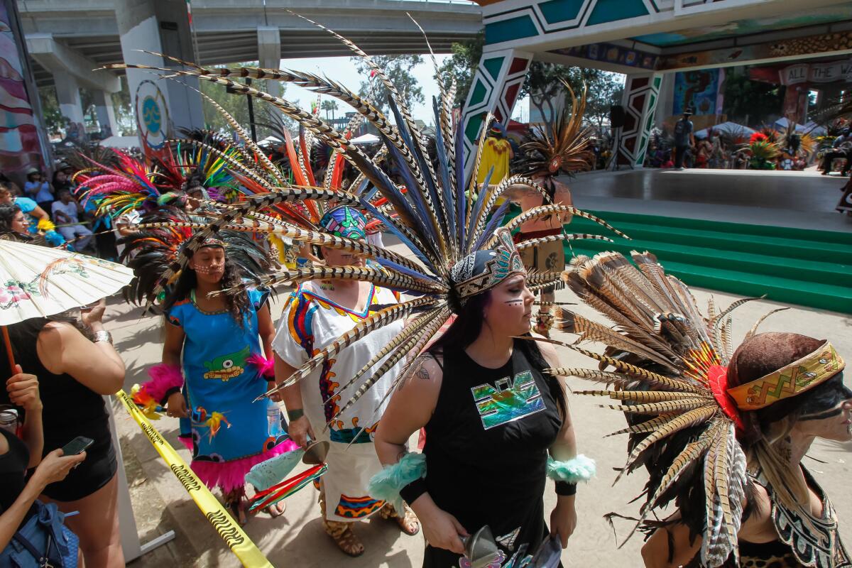Crowds enjoy a Danza Azteca performance on Chicano Park Day in 2017.