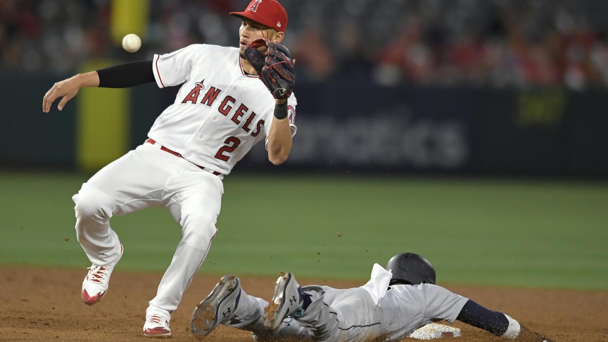 Kole Calhoun scores on wild pitch to push Angels past Mariners in 10 innings