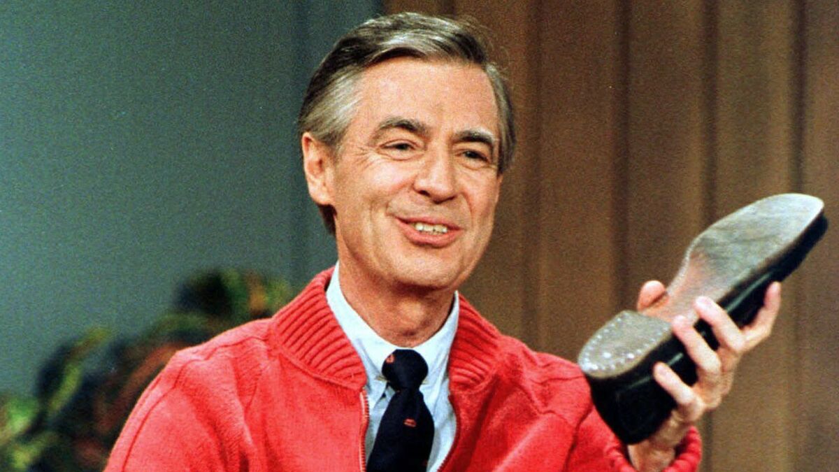 Authorities say a crew member working on a movie about Mister Rogers, seen here June 28, 1989, has died after he suffered an apparent medical emergency and fell two stories off a balcony Thursday, during a break in filming in western Pennsylvania.
