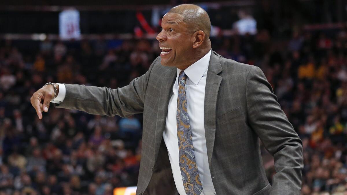 Coach Doc Rivers says he's staying put on the Clippers' sideline.
