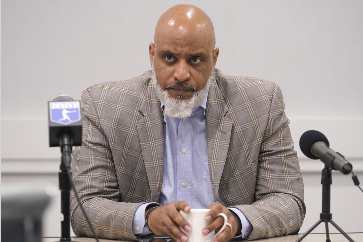 Major League Baseball union head Tony Clark listens to a question during a news conference in December.