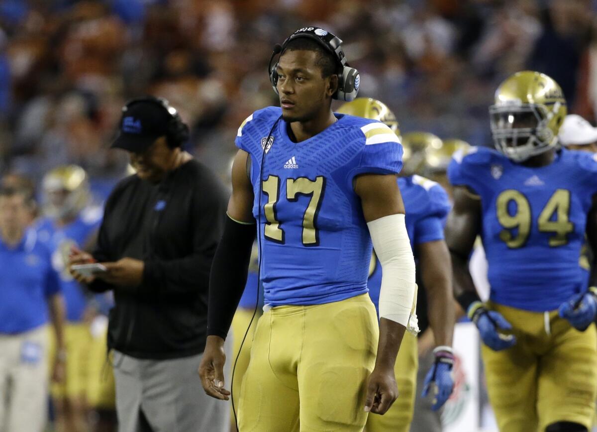 Brett Hundley's left arm is wrapped up after suffering an elbow injury during the first quarter of UCLA's 20-17 win over Texas on Sept. 13.