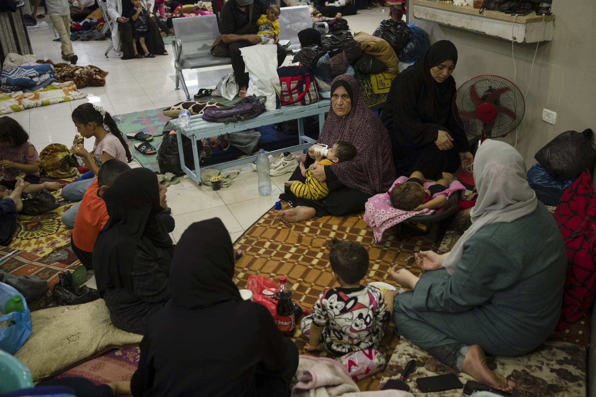 Palestinians sheltering in a hospital during Israeli bombardment of Gaza