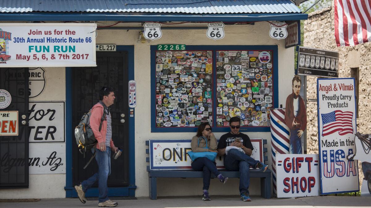 Visitors outside of Angel & Vilma Delgadillo's Original Route 66 Gift Shop. (Brian van der Brug / Los Angeles Times)