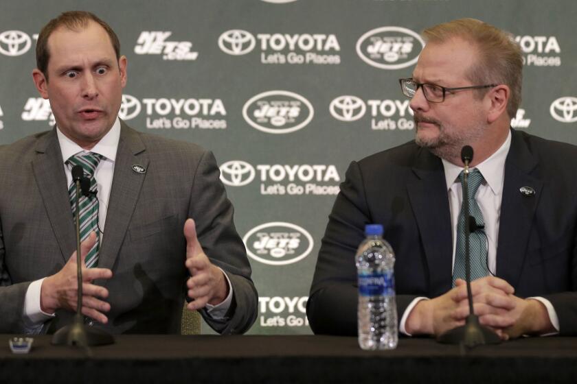 New York Jets head coach Adam Gase, left, speaks while general manager Mike Maccagnan looks on during a news conference in Florham Park, N.J., Monday, Jan. 14, 2019. (AP Photo/Seth Wenig)