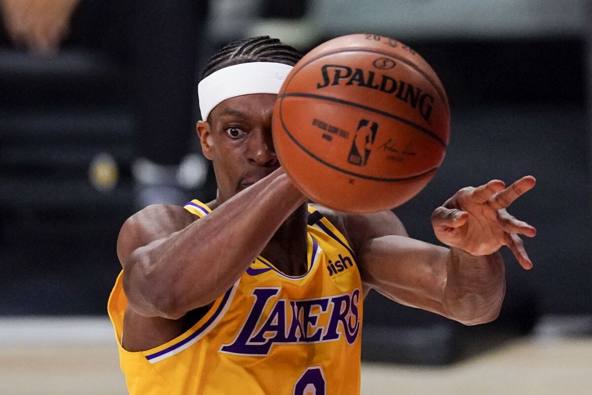 Los Angeles Lakers guard Rajon Rondo passes against the Miami Heat during the first half in Game 4 of basketball's NBA Finals Tuesday, Oct. 6, 2020, in Lake Buena Vista, Fla. (AP Photo/Mark J. Terrill)