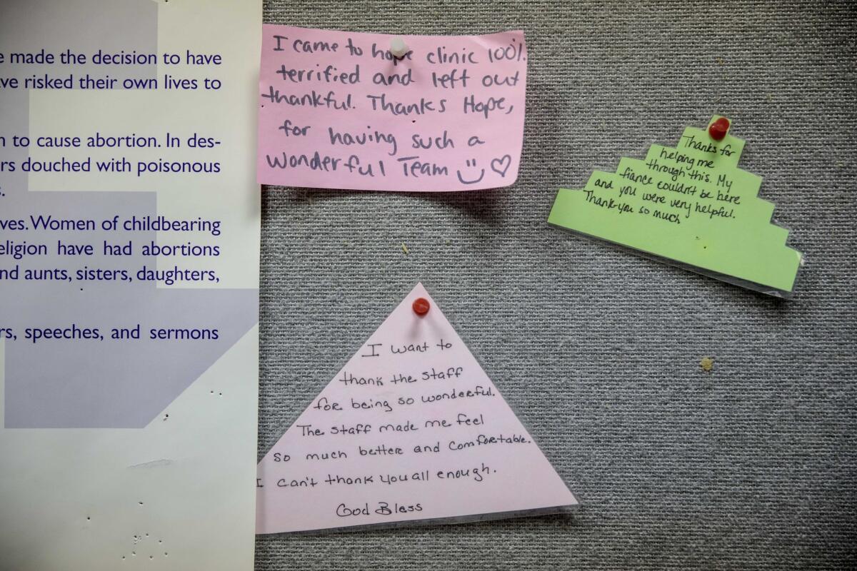 Notes left by patients are pinned to a board at Hope Clinic for Women in Granite City, Ill.