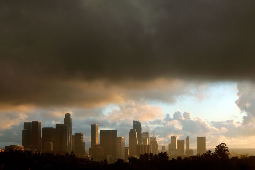 A cloud hangs over downtown Los Angeles